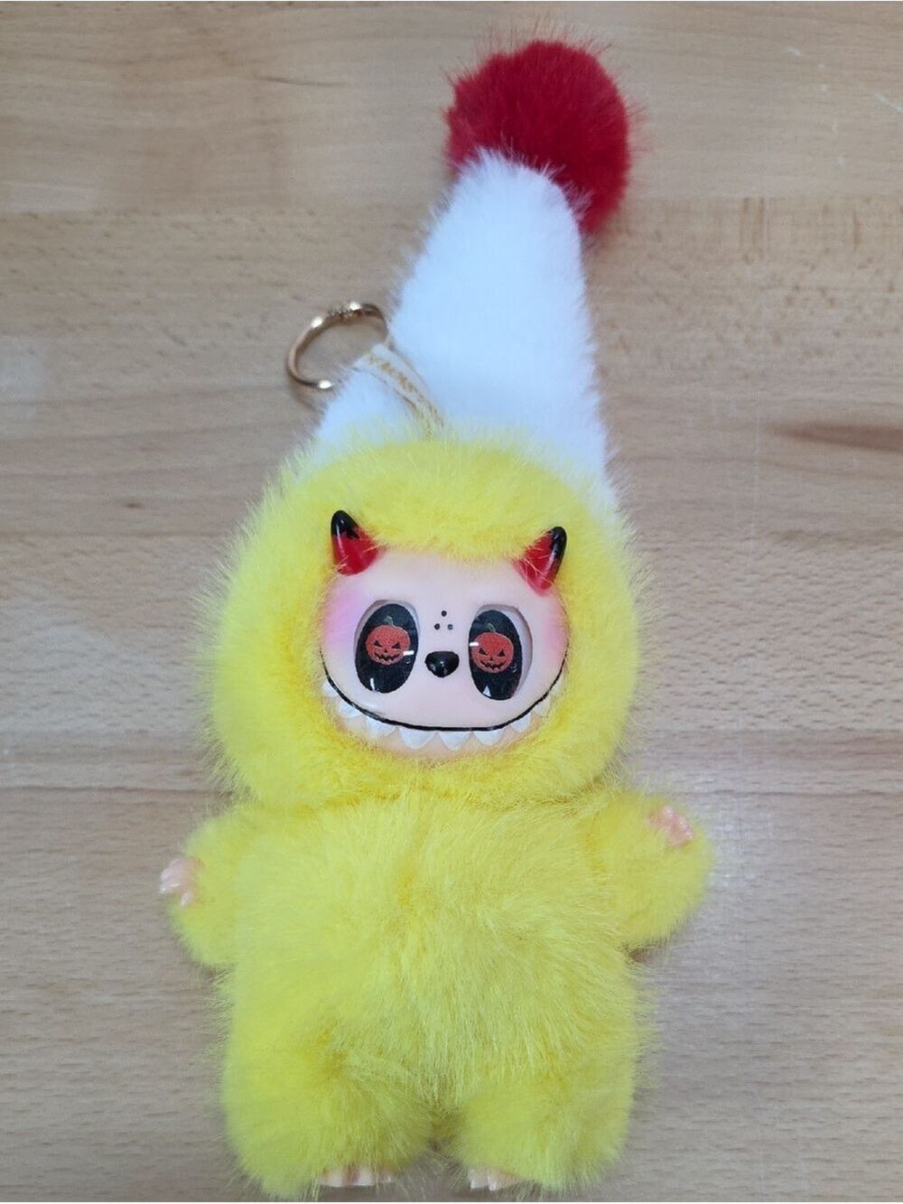 Yellow Furry Monster Keychain with White Red Pom Hat